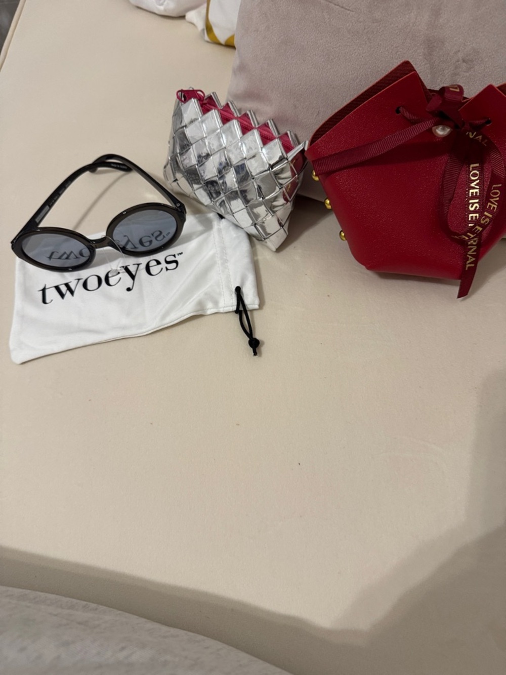 Misc items- Red bag- coin purse silver, cover & sunglasses probably kids